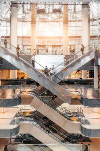 people going up and down escalators
