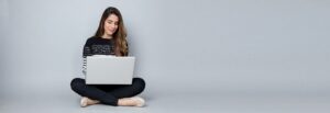 woman typing on a laptop