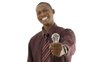 man holding a lightbulb to represent an idea