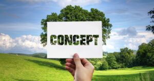 hand holding a paper that says "Concept"