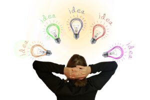 woman with lightbulbs around her head, stating "idea"