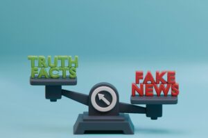 the phrases "Truth Facts" and "Fake News" on a set of scales