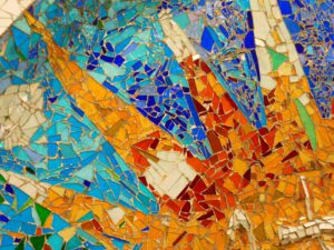 mosaic pieces making a sun pattern from Gaudi's Park Guell in Barcelona