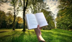 hand holding open book