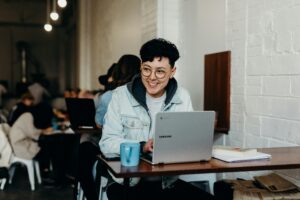 person typing at laptop