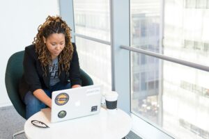 person typing at laptop