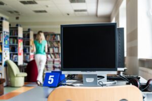 computers and books in library